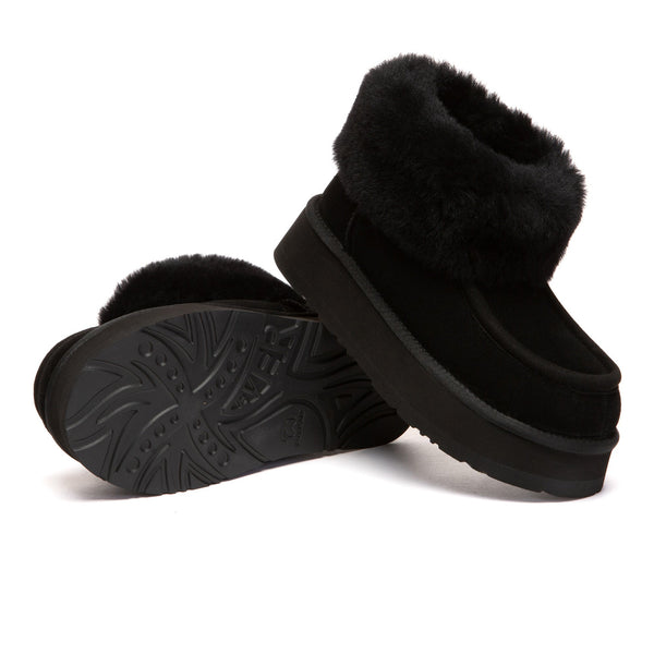 EverUgg Loofee UGG boots in brown leather with plush shearling lining and sturdy rubber sole, displayed on a neutral background.